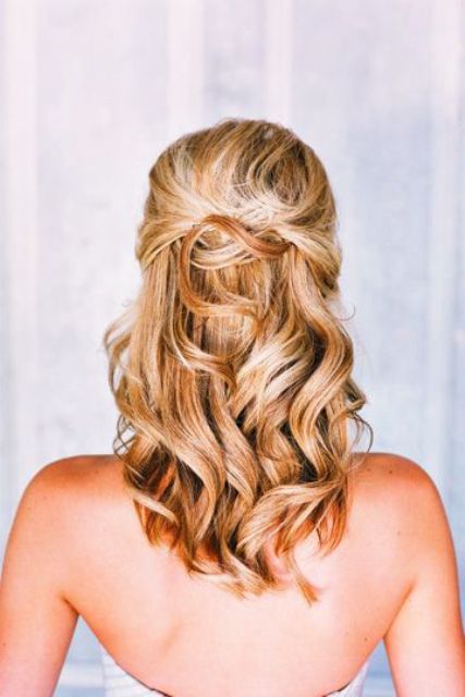 flirty and romantic half up curled hairstyle for a holiday date