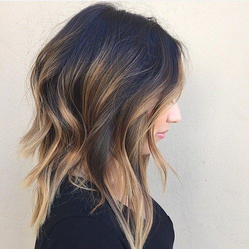a messy wavy long bob with balayage is effortlessly chic