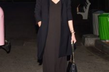 12 a minimal black slip dress with a long blazer and strappy sandals