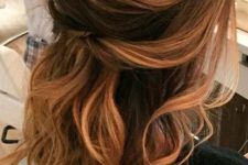 12 a wavy half updo with several twists looks sexy and chic