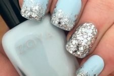 12 light blue nails with large scale silver glitter