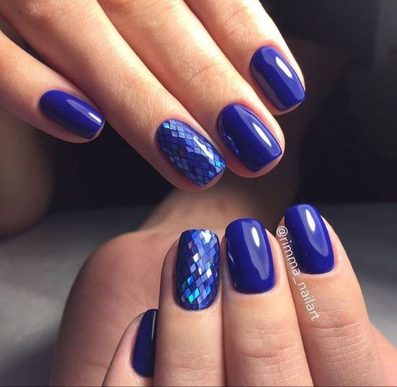 violet manicure with holographic nails that remind of fish scales