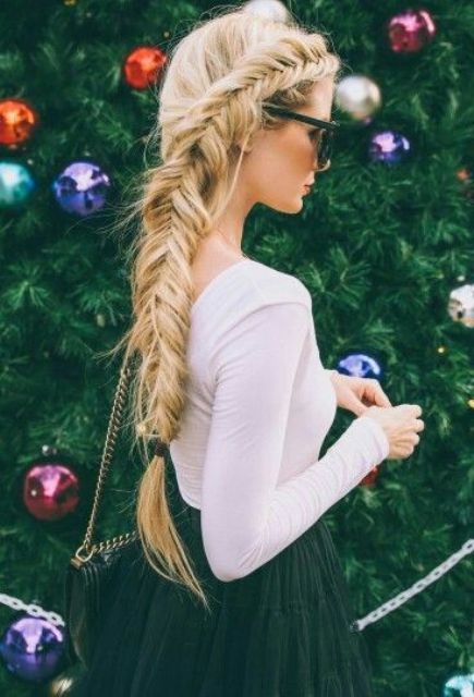 a large side fishtail braid is all you need for an eye-catchy look