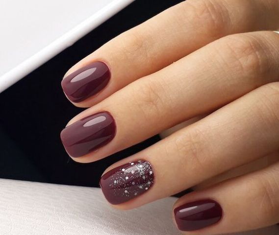 burgundy manicure with silver glitter and rhinestones for a gorgeous touch