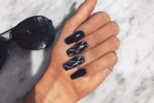14 long black nails plus two black marble accent ones are very edgy