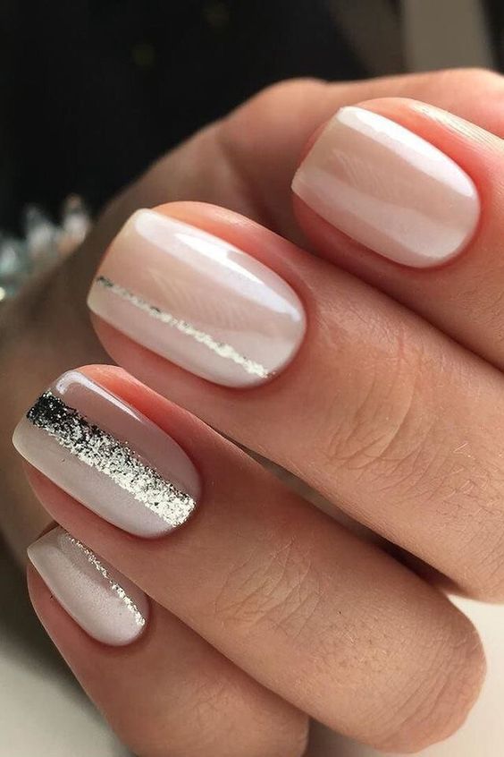 nude manicure with silver stripes looks very feminine and chic
