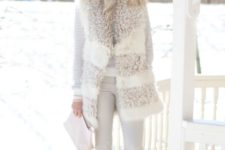 16 white skinnies, a neutral sweater, a faux fur vest, brown booties and a beanie