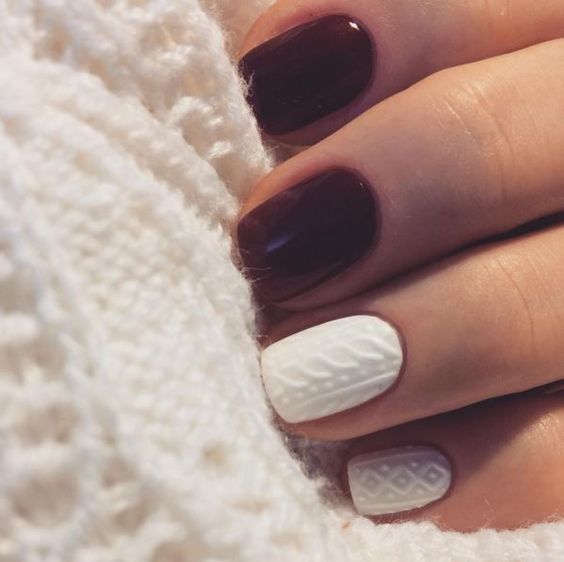 burgundy and white cable knit nails create a bold contrast and a cozy look