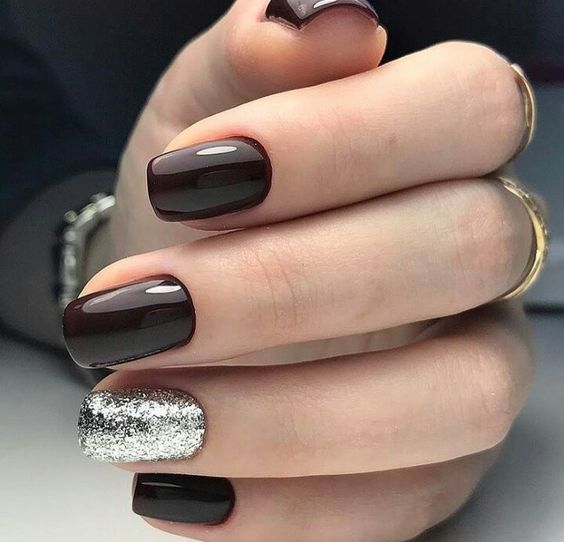 elegant black cherry nails with a silver glitter accent look very chic