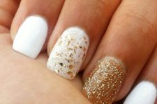37 white nails with a glitter gold one and a gold leaf one for a chic shiny look