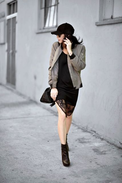 With black lace dress, ankle boots, bomber jacket and black bag