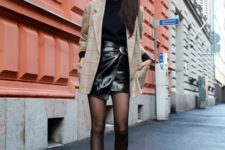 With black shirt, printed long blazer and black leather boots