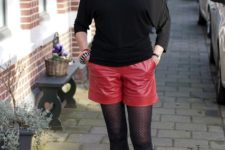 With black shirt, printed scarf, red shorts and mid calf boots