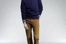 With checked shirt, navy blue sweater, blue cap and brown trousers