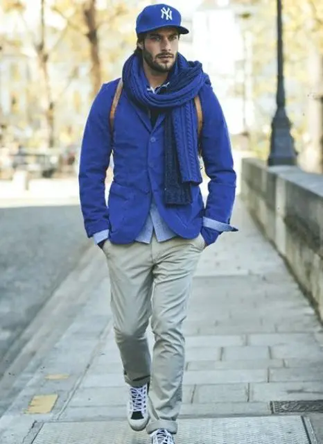 With cobalt blue jacket, scarf, beige pants and shoes