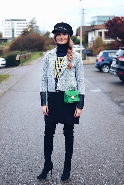 With gray coat, over the knee boots and green mini bag