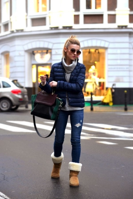 With gray hoodie, navy blue puffer jacket, jeans and green and marsala bag