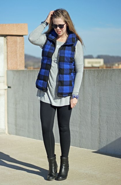With gray loose shirt, black leggings and heeled boots