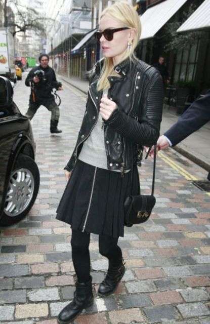 With gray shirt, black skirt and leather jacket