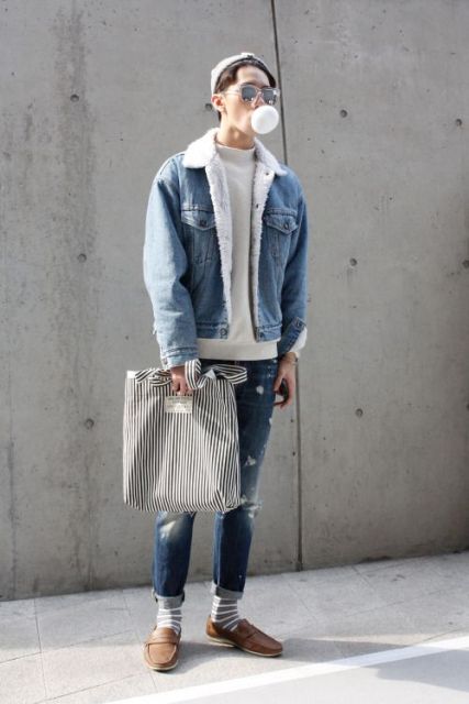 With gray sweatshirt, distressed jeans, gray beanie, striped socks, brown shoes and striped tote