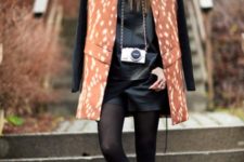 With leather shirt, ankle boots and printed coat
