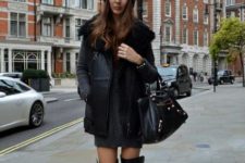 With mini dress, leather boots and black bag