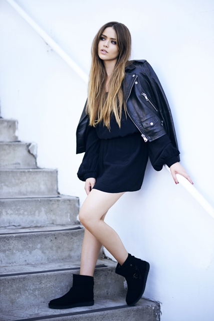 With navy blue mini dress and black leather jacket
