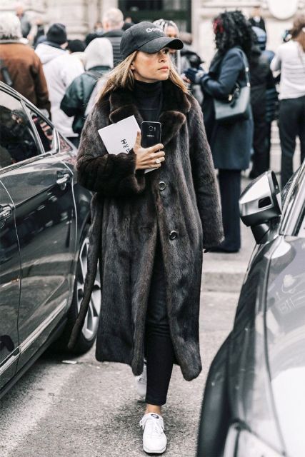 With pants, maxi fur coat and white sneakers