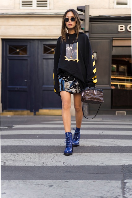 With printed hoodie, blue boots and printed bag