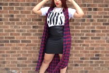 With printed t-shirt, leather skirt, ankle boots and black hat