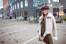With shearling jacket, olive green dress and bag