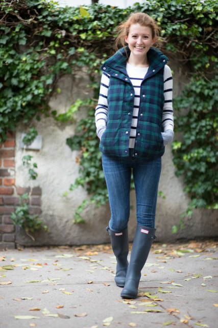 With striped shirt, jeans and gray high boots