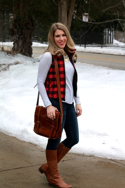 With striped shirt, jeans, brown high boots and brown leather bag
