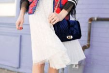 With striped shirt, white skirt and velvet bag