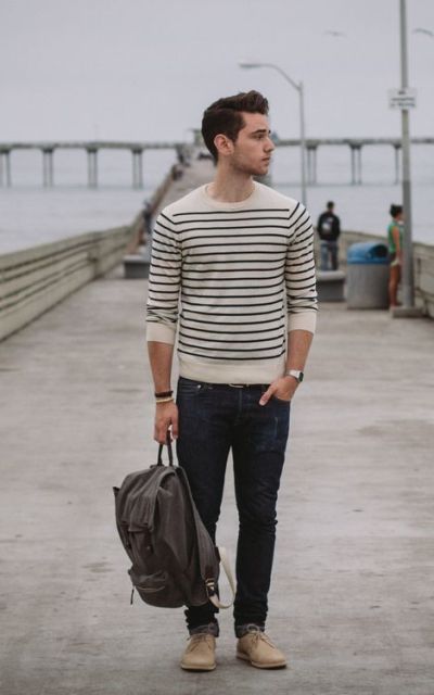With striped sweater, jeans and gray backpack