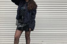 With t-shirt, ankle boots and fur jacket