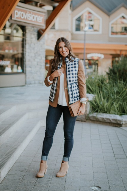With white blouse, camel jacket, cuffed jeans, beige ankle boots and clutch