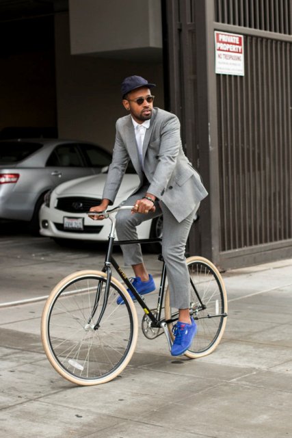 With white button down shirt, gray suit and blue sneakers