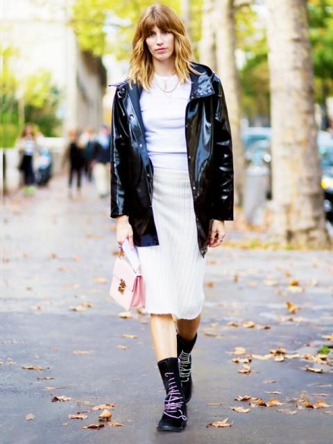 With white shirt, beige skirt, pale pink bag and boots