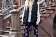 With white shirt, black fur vest, floral pants and ankle boots