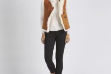 With white shirt, black skinny pants and shearling boots
