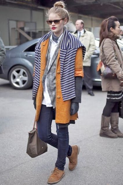 With white shirt, gray cardigan, brown coat, jeans and small bag