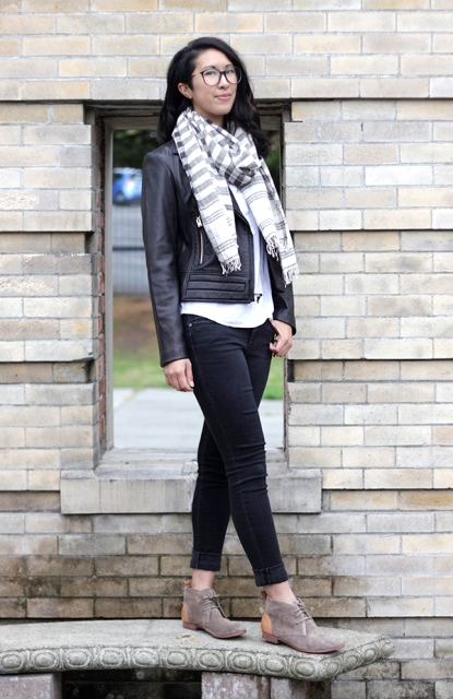 With white shirt, leather jacket, striped scarf and cuffed jeans