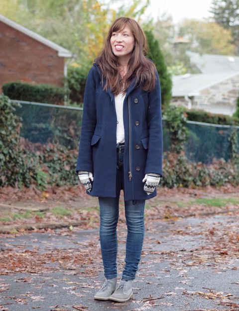 With white shirt, navy blue coat and skinny jeans