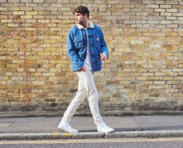 With white t shirt, beige trousers and white sneakers