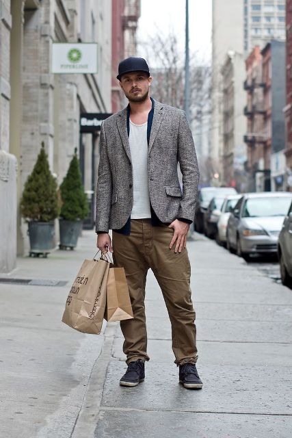 With white t-shirt, gray jacket, olive green pants and shoes