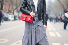 With white top, printed maxi skirt, leather jacket, shoes and red bag