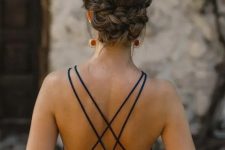 a beautiful braided low updo with a bump on top is a stylish idea for a more formal wedding, and it will also fit a boho look