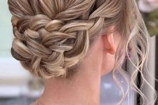 a braided updo with a volume on top and waves down is a lovely boho or just romantic hairstyle