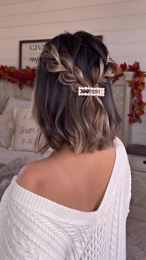 a catchy half updo with braids, waves and a pretty pearl hair piece is a lovely solution for a holiday party